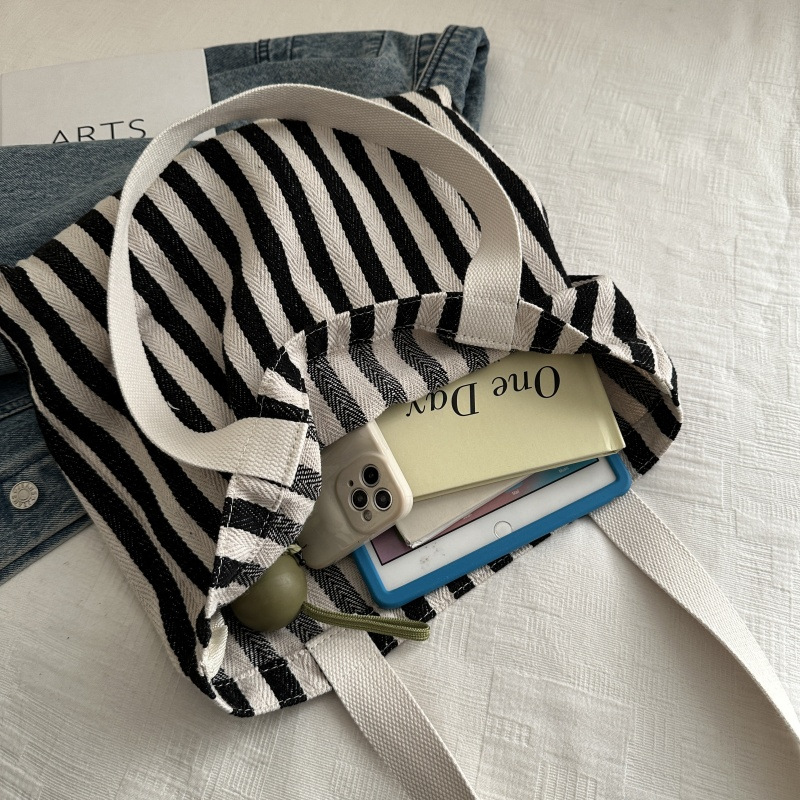 The new cross-border vertical striped commuter tote bag, hand-held shoulder bag, is fashionable and has a large capacity. It features an InS-style simple letter sail undefined