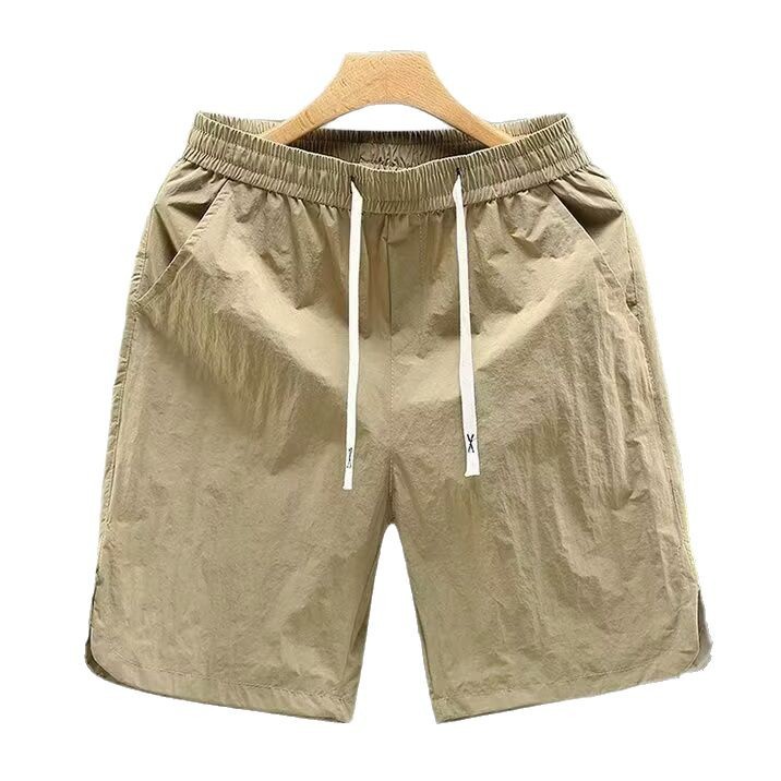 Nuevos pantalones de tendencia de cinco puntos para hombres comercio exterior transfronterizo de verano pantalones de playa para hombres pantalones cortos deportivos de cinco puntos para hombres pantalones de tendencia