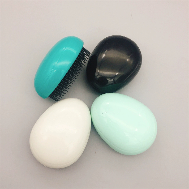 Yangzi fábrica venta al por mayor en forma de corazón belleza peine del pelo masaje peine del pelo mojado y seco de doble uso peine del pelo cáscara de huevo peine de tt mágico