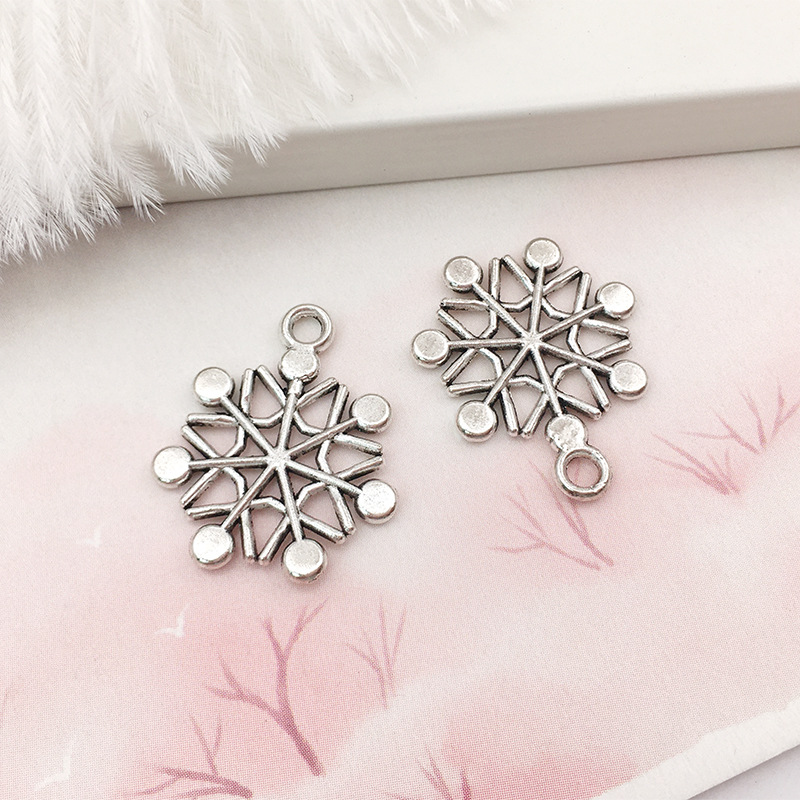 1 copo de nieve aleación colgante DIY aleación joyería brillante plata hueco copo de nieve colgante transfronterizo Amazon Venta caliente