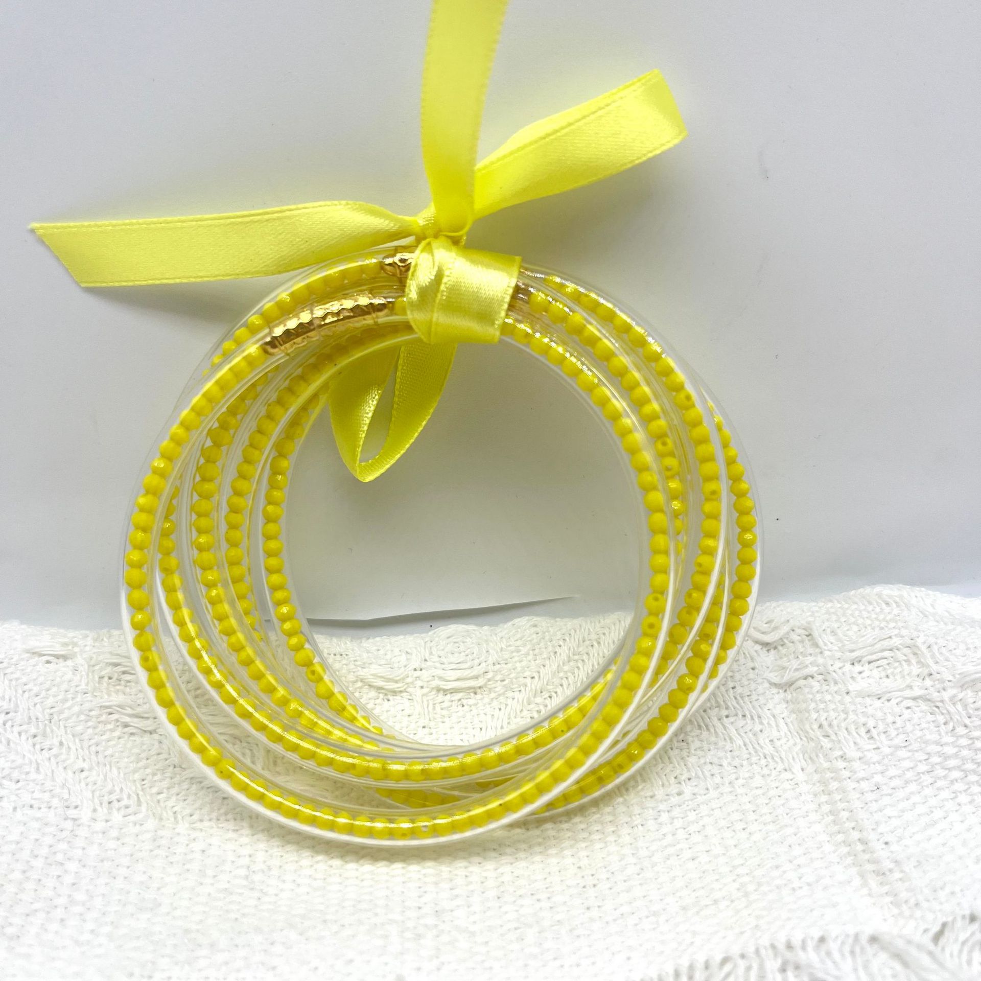 Retro Simple Style Bow Knot Glass Silica Gel Unisex Bangle display picture 4