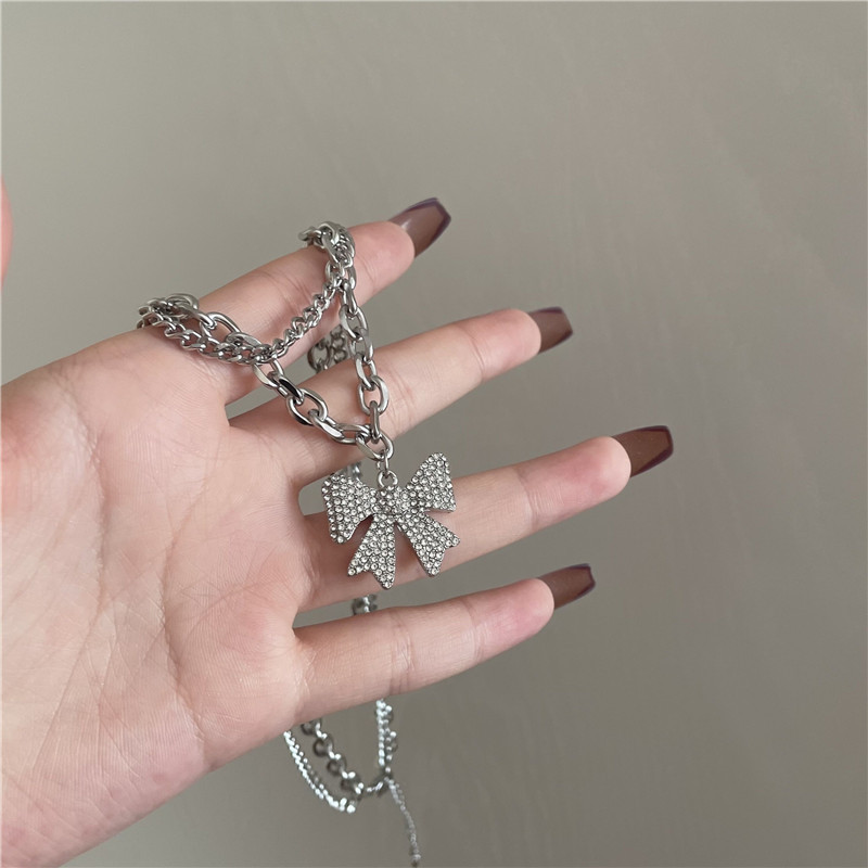stainless steel sweater chain microinlaid bowknot pendant necklacepicture4
