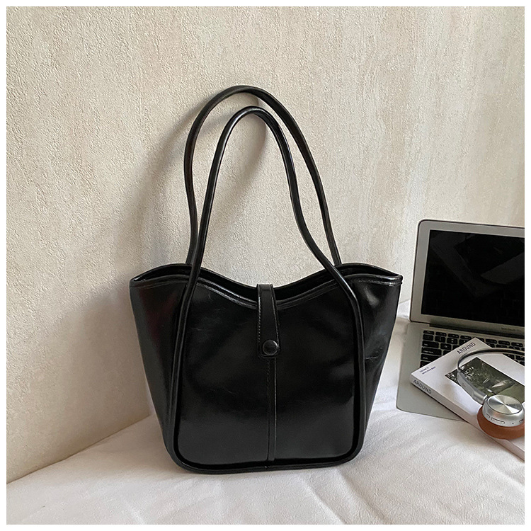 Este año, la moda simple bolso de cubo de mujer venta caliente nueva textura de alta calidad retro versátil lujo ligero bolso de hombro
