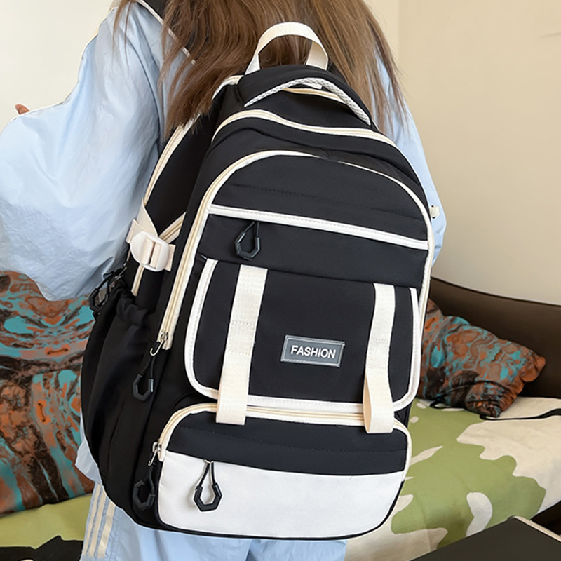 Mochila escolar 2024 mochila de estilo nuevo todo fósforo ocio para estudiantes de secundaria y preparatoria Mochila de viaje de color de contraste simple y de gran capacidad