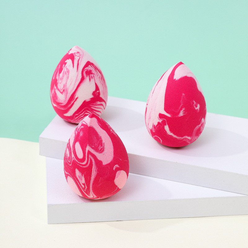 La borla de polvo de huevo de belleza de color mixto transfronterizo se agranda cuando se encuentra con el agua, gotitas de agua, esponja de maquillaje sin látex en forma de calabaza, personalización de fábrica de huevos