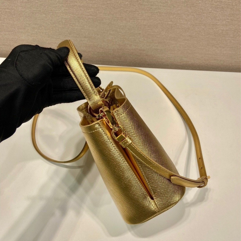 New color bucket bag 1BA373 in gold, crafted from Saffiano leather, features an elegant design for women