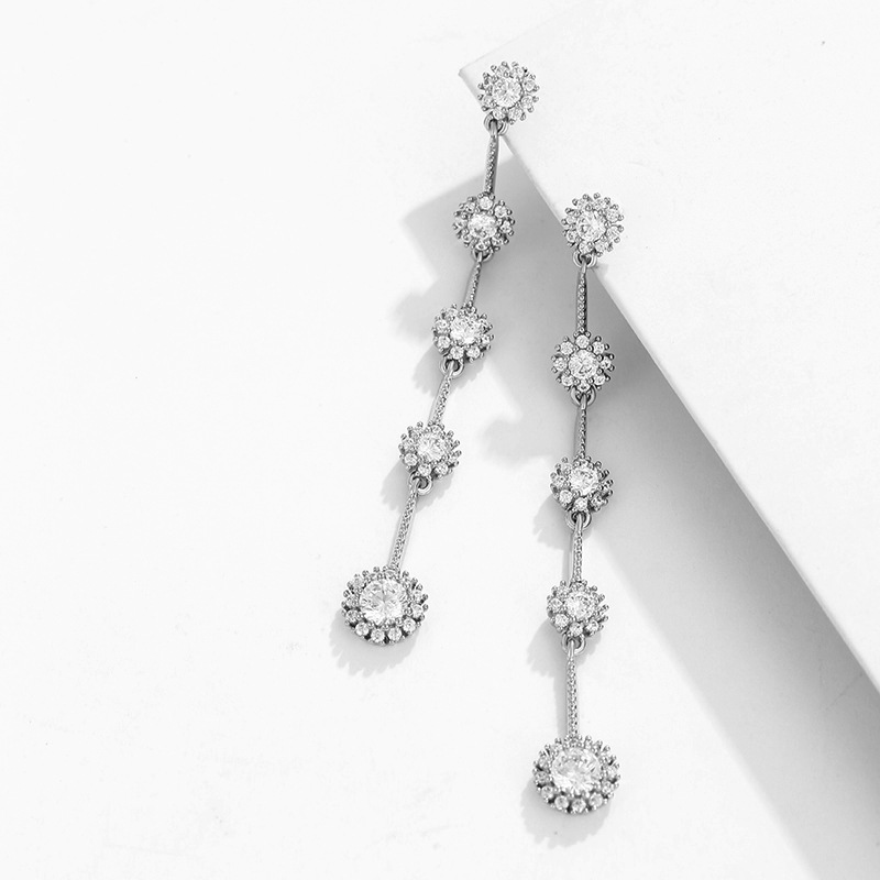 Xupin joyería aleación con incrustaciones pendientes de girasol temperamento femenino largo borla pendientes de hadas joyería al por mayor