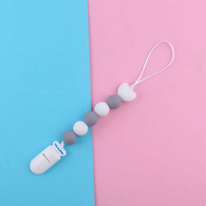 Nuevo bebé suministros de dibujos animados amor silicona DIY creativo macaron color serie mordedura cola molar pezón