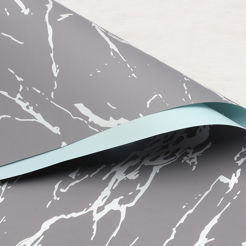 Huaxi Ouya Paper Mármol Papel de embalaje de flores Impresión engrosado Papel de flores impermeable Florería Ramo de flores Embalaje floral