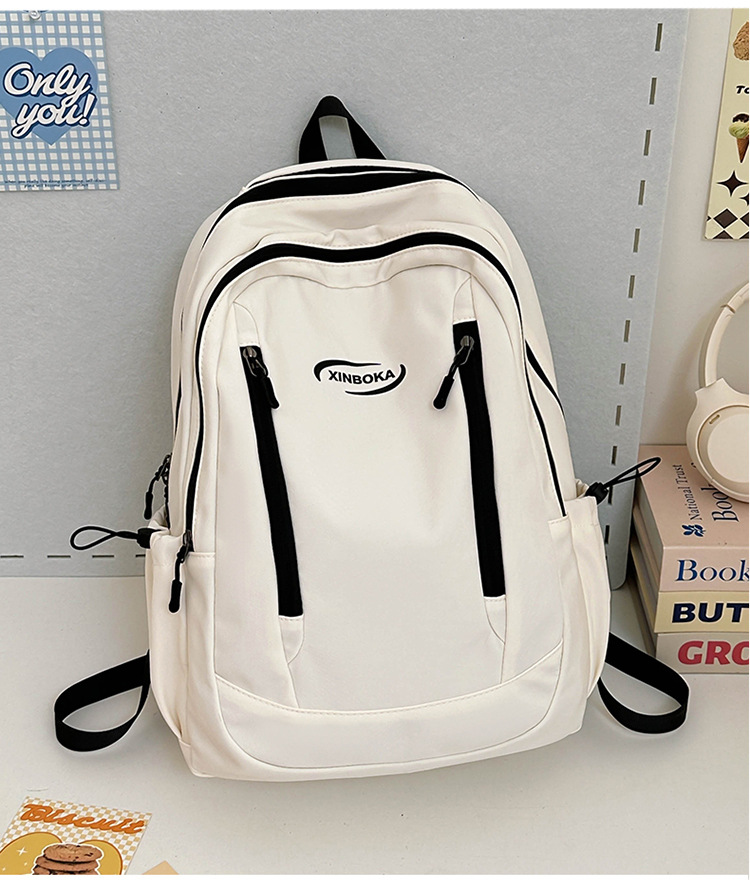 Fabricantes de mochilas escolares, estudiantes universitarias al por mayor, simples y versátiles, versión coreana de mochilas de ocio de nicho engrosadas