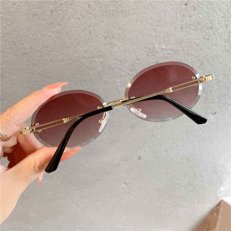 New Sunglasses Women's Oval Gradient Sunglasses Frameless Cutting Edge Trendy Glasses_voghion.com