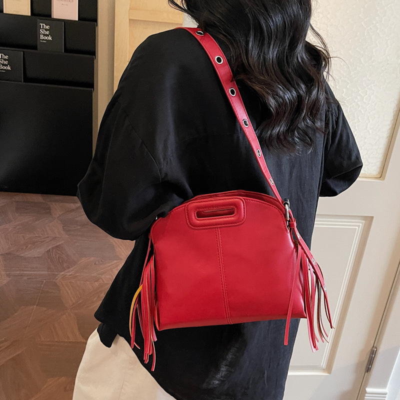 Bolsa de mano de moda con bordas 2026 temperamento de viaje al trabajo sensación cotidiana de salida de hombro de mujer
