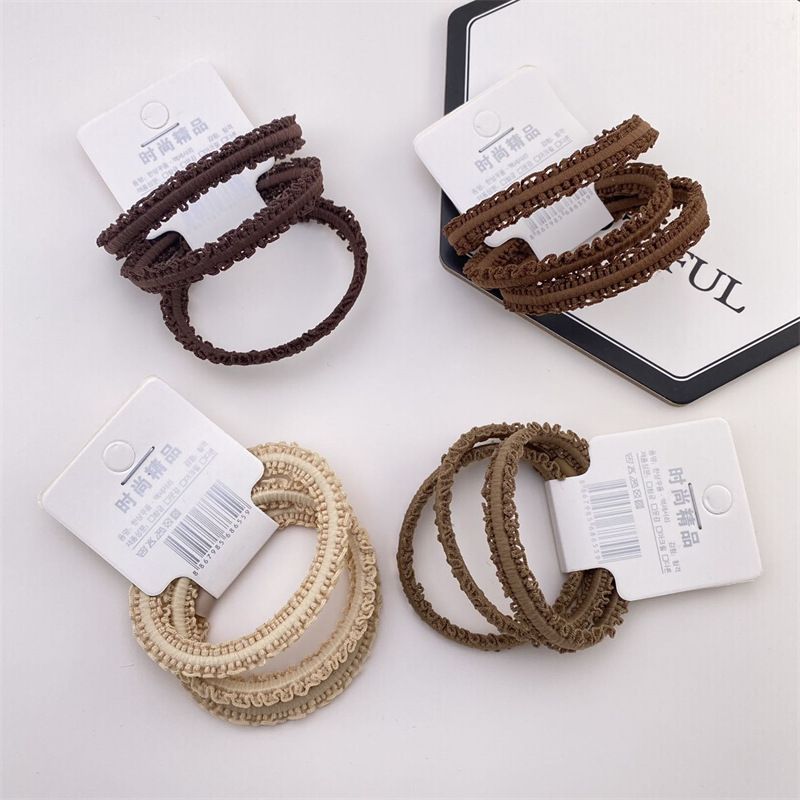 Nueva cuerda de pelo montada en la tarjeta de estilo coreano simple leche té color encaje diadema 3 banda de goma montada en la tarjeta Mujer 2 yuanes suministro de la tienda