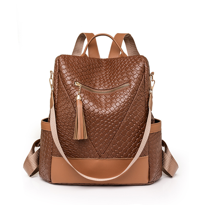 Comercio exterior al por mayor 2024 nuevas señoras casuales mochila antirrobo moda borla tejida mochila de viaje de doble uso marea