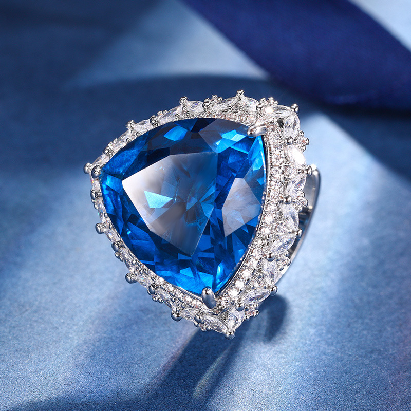 El otoño y el invierno Nueva Zhuang Sheng joyas de cobre de fondo chapado en oro de simulación azul de cristal puntiagudo traje avanzado 17*17-12*12