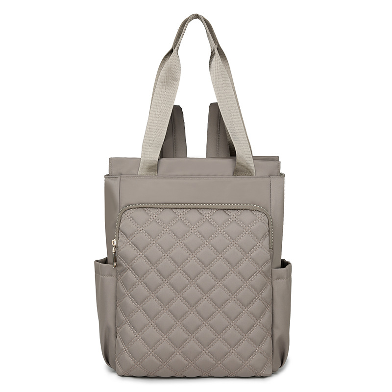 Mochila de mujer salvaje de color puro 2024 nueva mochila portátil de moda, bolso de viaje ligero y de gran capacidad