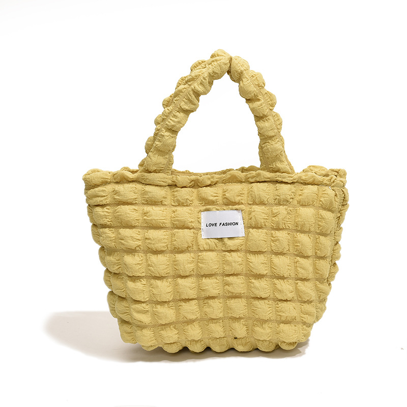 Versión coreana del nuevo bolso de hombro de color caramelo de corazón de niña pliegue de burbuja de nube simple bolso de gran capacidad mujer