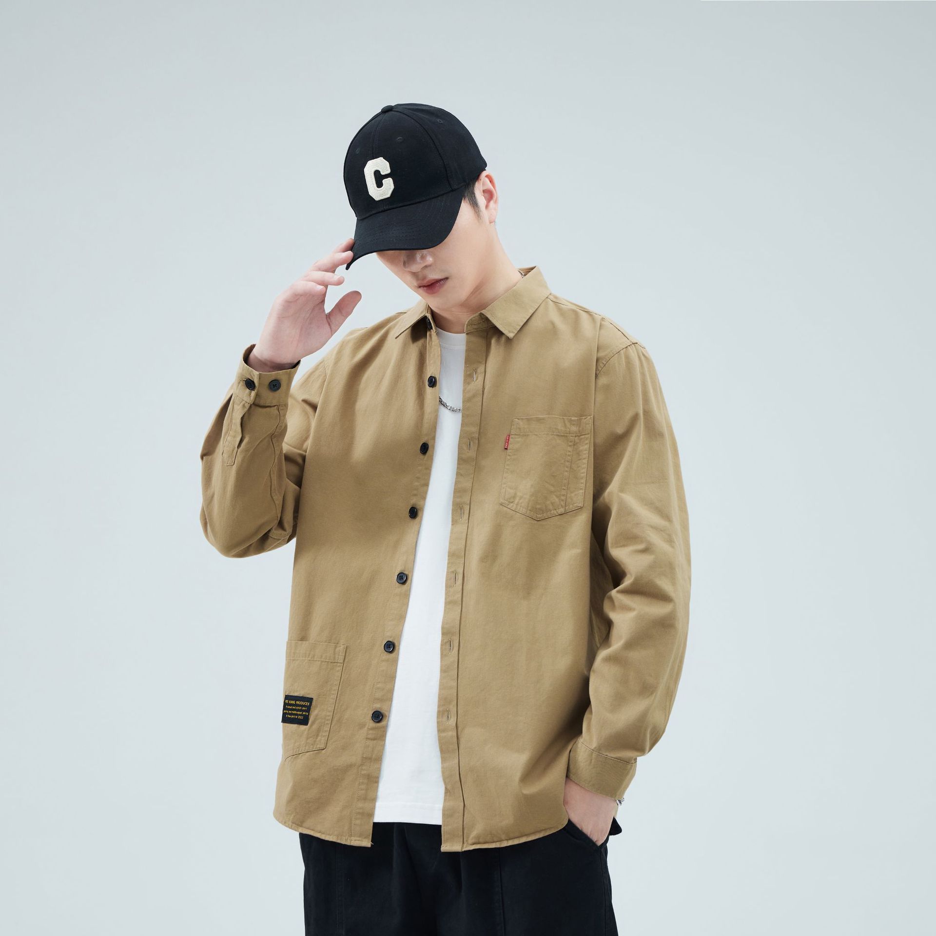 Camisas masculinas primavera-verano 2024 moda camisa de algodón de manga larga estilo de moda de alta sensación de estilo americano con solapa de bolsas