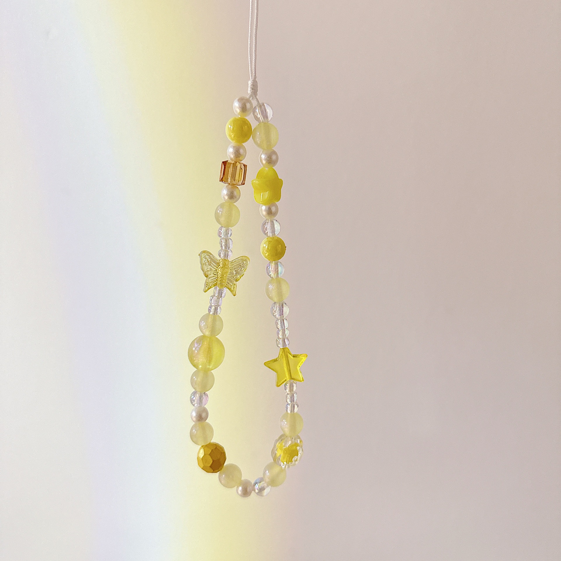 Cadena aplicable nicho mariposa corta cadena de muñeca arco cuentas de caso de teléfono móvil colgante tipo correa de muñeca anti-pérdida