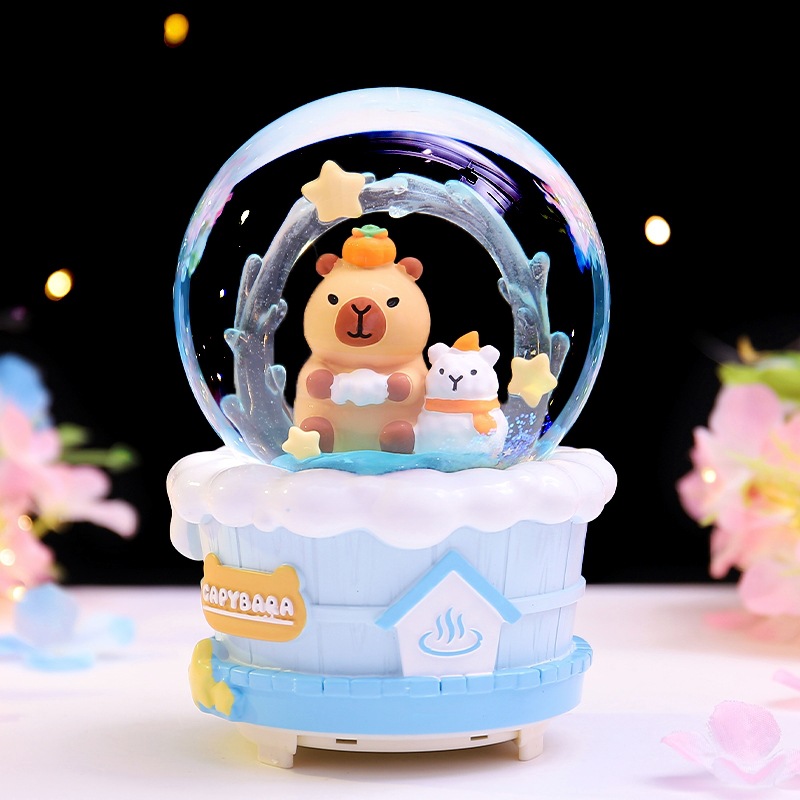 Caja de música de bola de cristal de Kapibala ingenua y linda, adornos de escritorio luminosos, nieve que cae, regalo de cumpleaños para estudiantes y niños