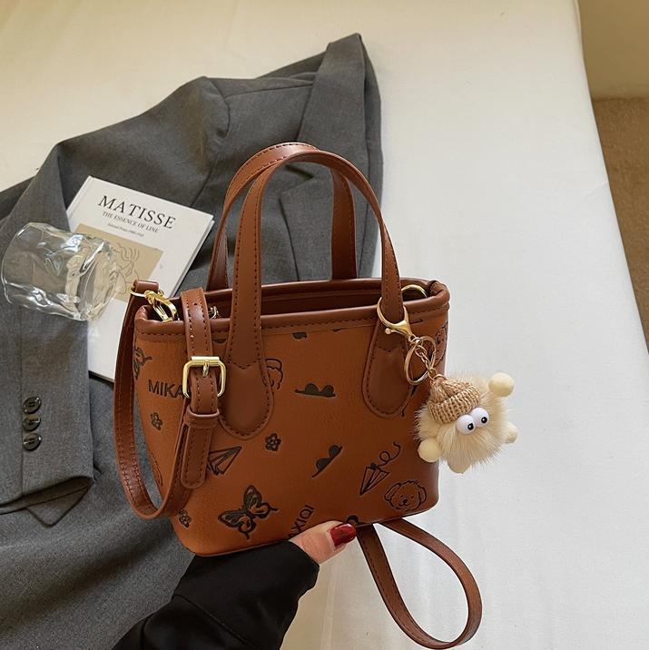 Bolso de mano de tendencia universal para mujeres 2025 nuevo estilo de moda de estilo exterior bolso de hombro casual de alta calidad textura mochila