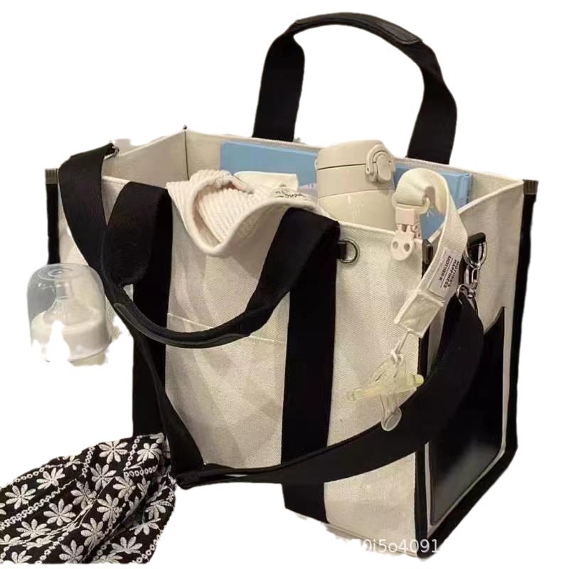 Bolsa coreana de gran capacidad simple para mamás, bolso de hombro portátil, bolso impermeable, pañales de lona, bolso para madre y bebé.
