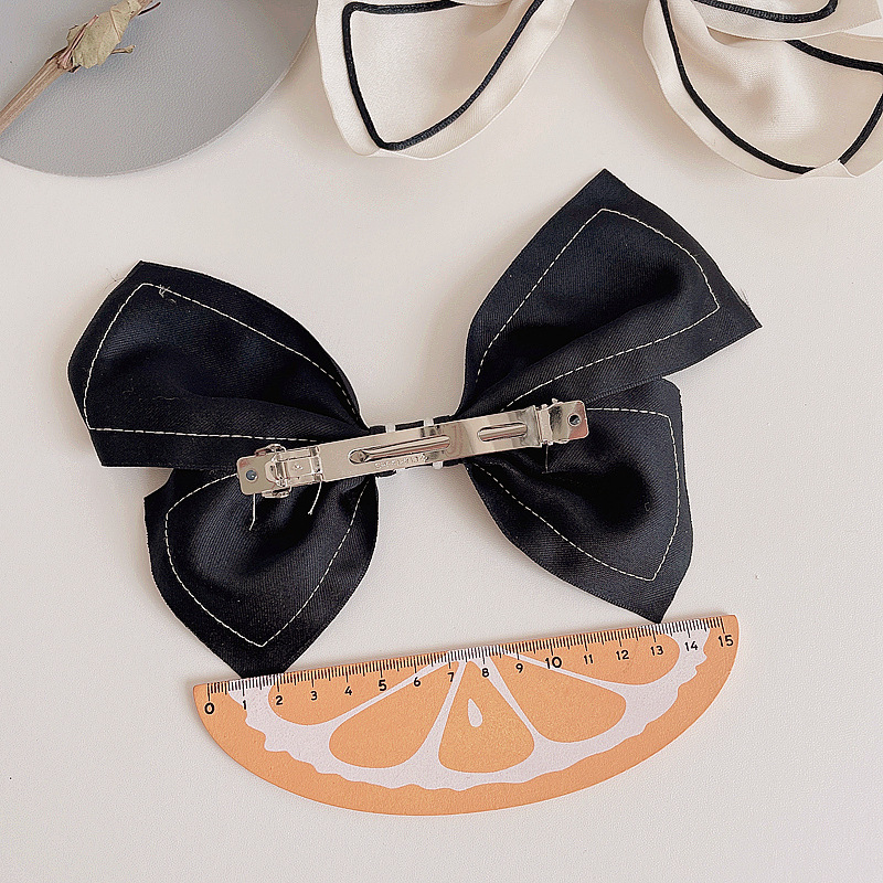 Fashion Retro Bow Simple Contrast Color Hairpin display picture 5