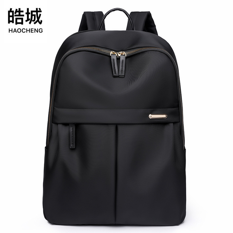2023 verano nuevo estilo versión coreana de la mochila de nailon para mujer simple y versátil mochila para computadora ligera de gran capacidad al por mayor