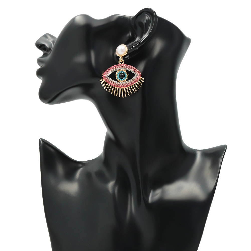 Metal Fashion Pearl Devil Eye Earrings display picture 5