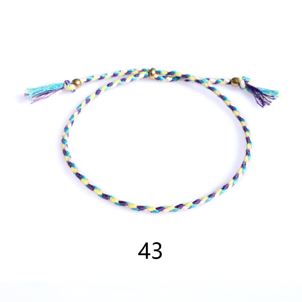 Amazon popular colorido cuerda de algodón amistad pulsera perlas de cobre borla pulsera tejida a mano ajustable hombres y mujeres pulsera