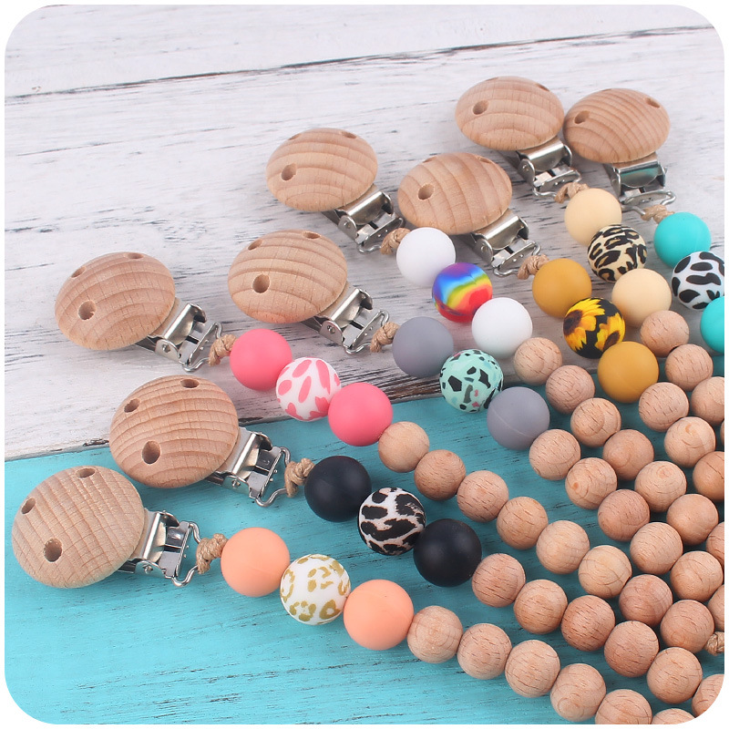 Nuevos suministros para bebés Beech chupete clip calmante bebé macaron cuentas impresas mordedura chupete cadena anti-caída de la cadena