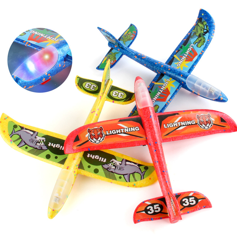 Tiktok Venta caliente espuma luminosa Catapulta Aviones pistola lanzador de mano planeador juguetes para niños al aire libre puesto juguetes del mercado nocturno
