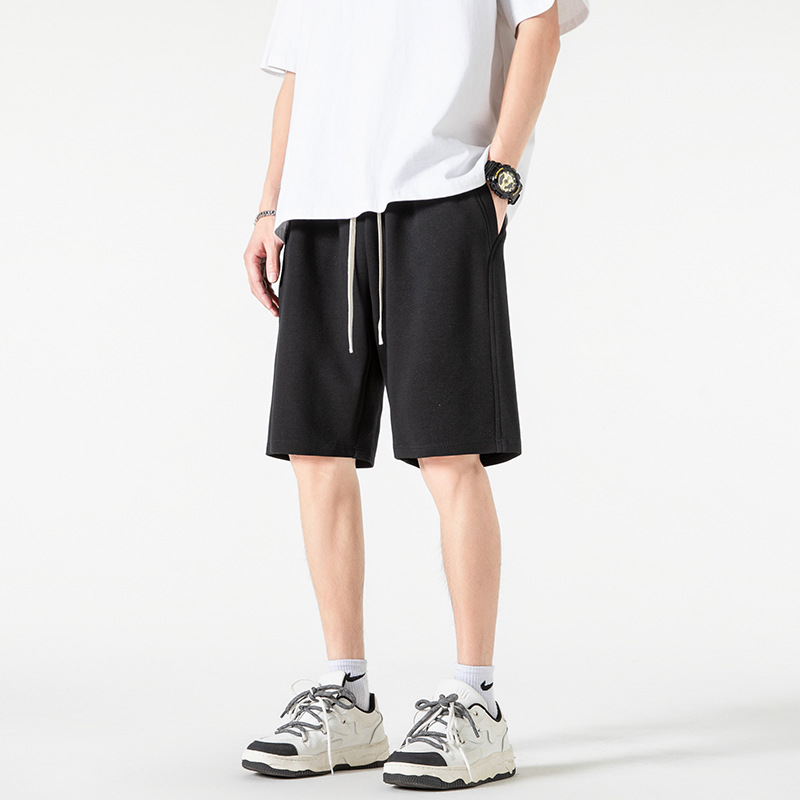 Pantalones cortos deportivos de punto de algodón chino 2025 nuevos productos de verano estilo básico calle sueltos pantalones de cinco puntos de marca de moda americana