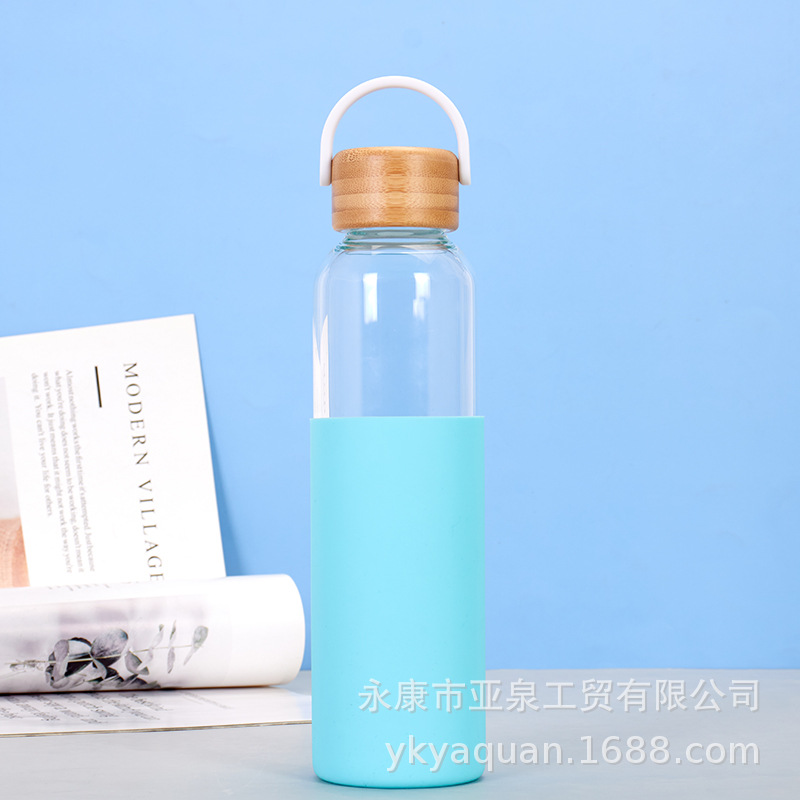 Suministro directo de fábrica Taza de vidrio con tapa de bambú transparente Taza de agua de vidrio de té de oficina de gran capacidad Taza de plástico transparente al por mayor