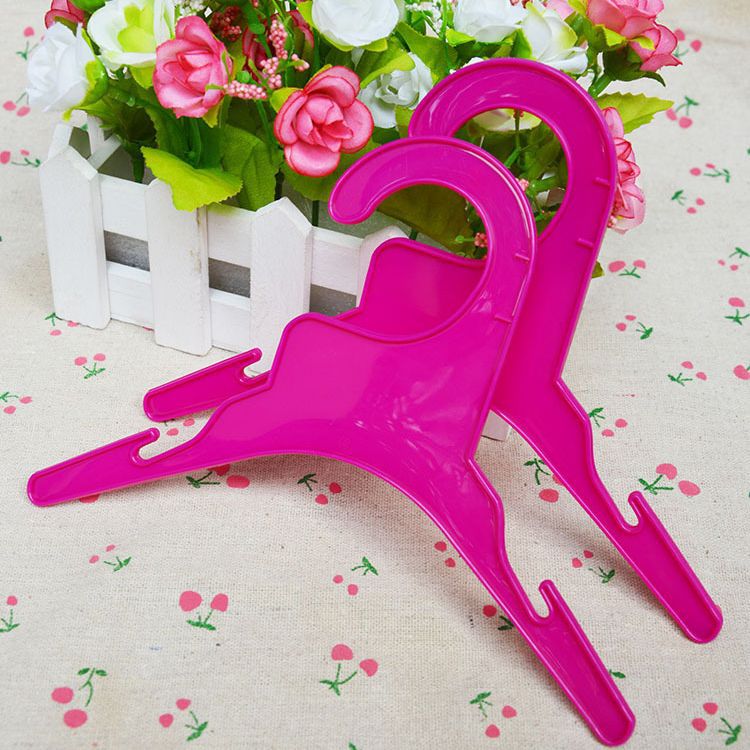 Ropa de perro percha de plástico percha de mascotas percha de niños percha pequeña fábrica de percha al por mayor venta directa lindo perro pequeño
