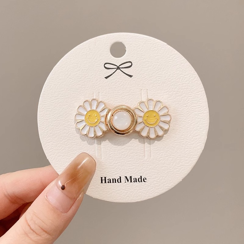 La cintura de los jeans se cambia a un botón de cintura pequeño, broche, falda de mujer, ajuste de cintura, dispositivo de ajuste, alfiler, botón anti-luz fijo