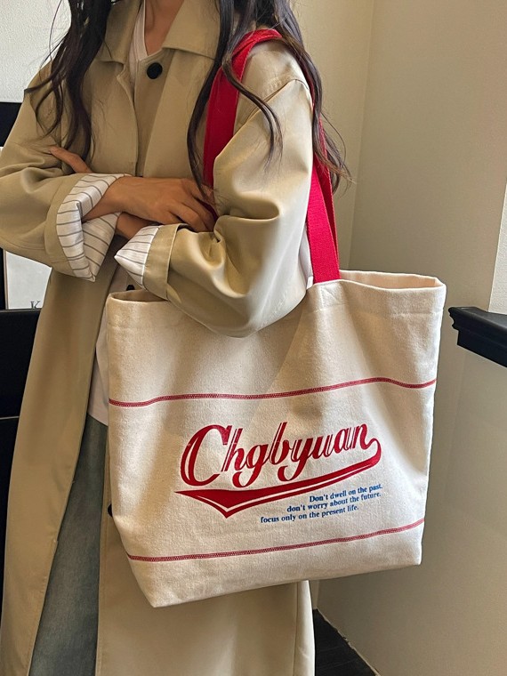 Bolsa de lona para mujeres 2026 nueva bolsa de hombro portátil simple y versátil bolsa de viaje de clase diaria
