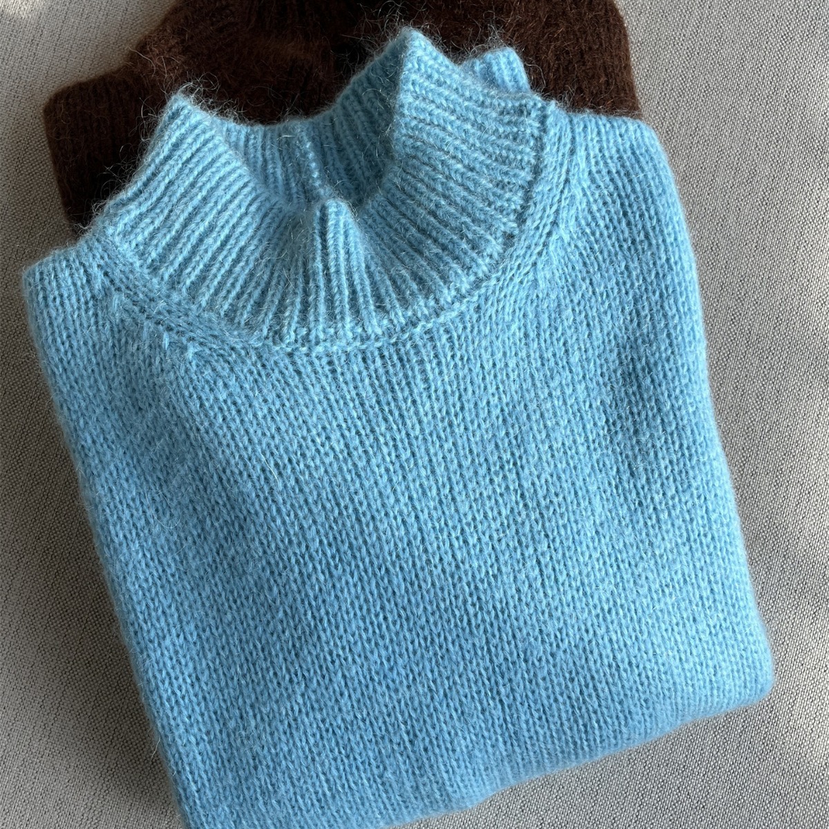 Demi-season solid color colored long sweater with a round collar