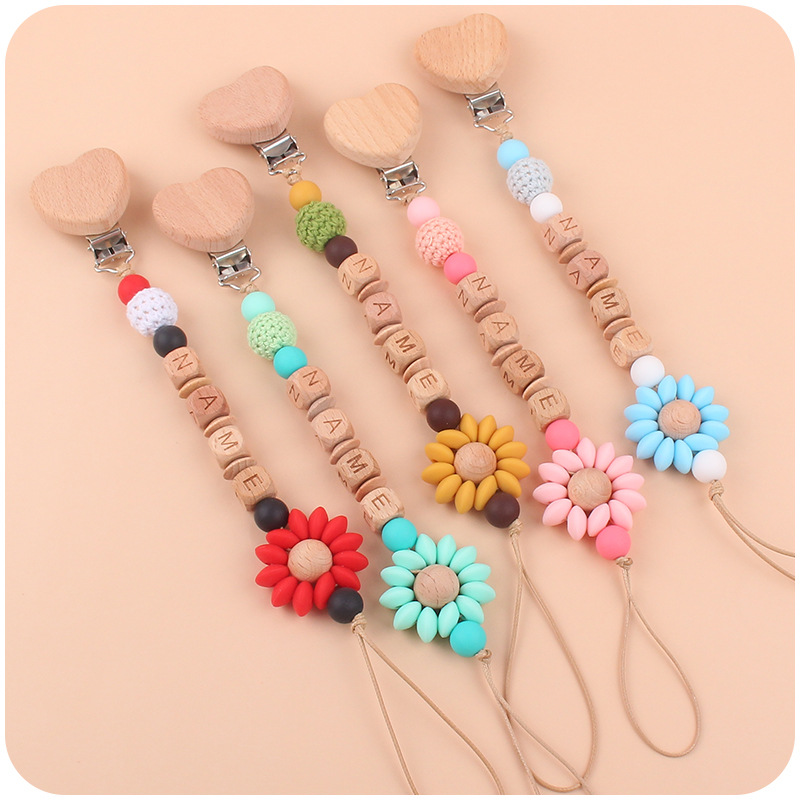 Nuevo bebé suministros de haya amor chupete clip calmante bebé Flor de dibujos animados mordedura de silicona molar chupete cadena