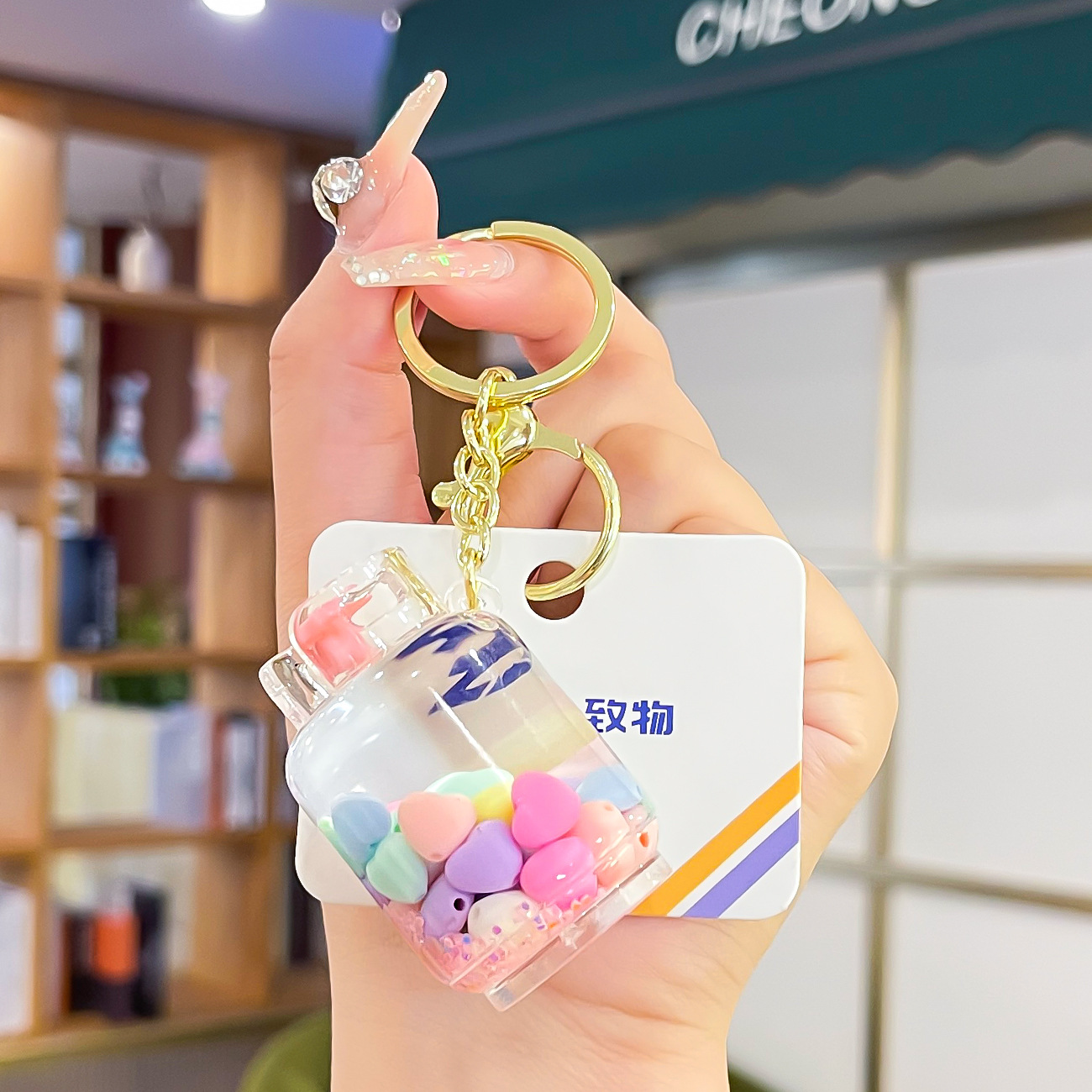 Nuevo aceite de arenas movedizas llavero lindo deriva botella de arenas movedizas colgante coche de dibujos animados llavero pequeño regalo al por mayor