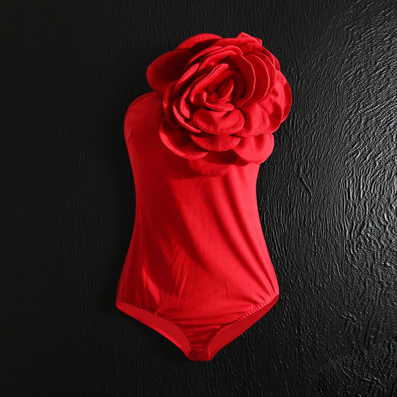 2024 verano nuevo europeo y americano hombro oblicuo diseño tridimensional flor costura sin mangas color sólido mono sexy moda ropa de mujer
