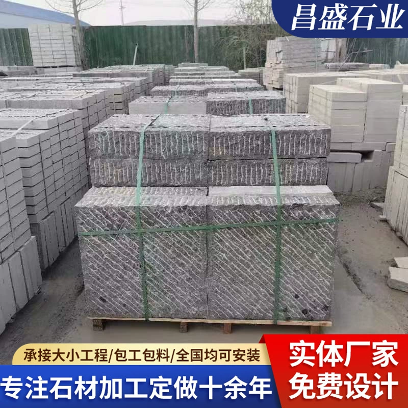 Hand-cut bluestone construction project paving roadside stone square scene area chisel road surface stone bluestone