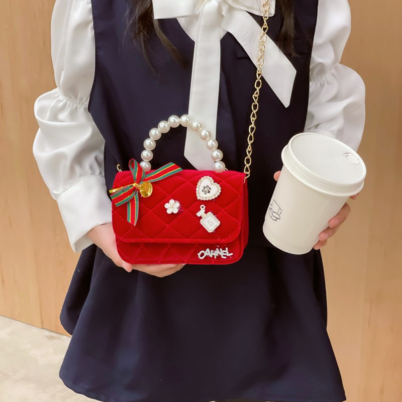 Bolso de niños nuevo bolso de perla rojo de Año Nuevo lindos princesas niñas bolso de hombro de cadena de estilo extranjero bolso de mochila