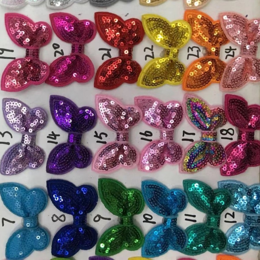 Wholesale of sequin computer-embroidered bow ties, 5CM, with glittery rabbit ear hair accessories, headbands, and small flower embellishments – manufacturer
