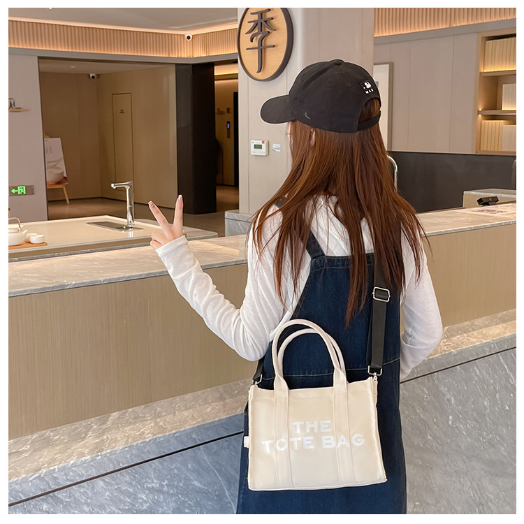 Bolso de lona Hebei Baiou para mujer, de color sólido con estampado de letras, bolso bandolera de un solo hombro con estampado de letras.