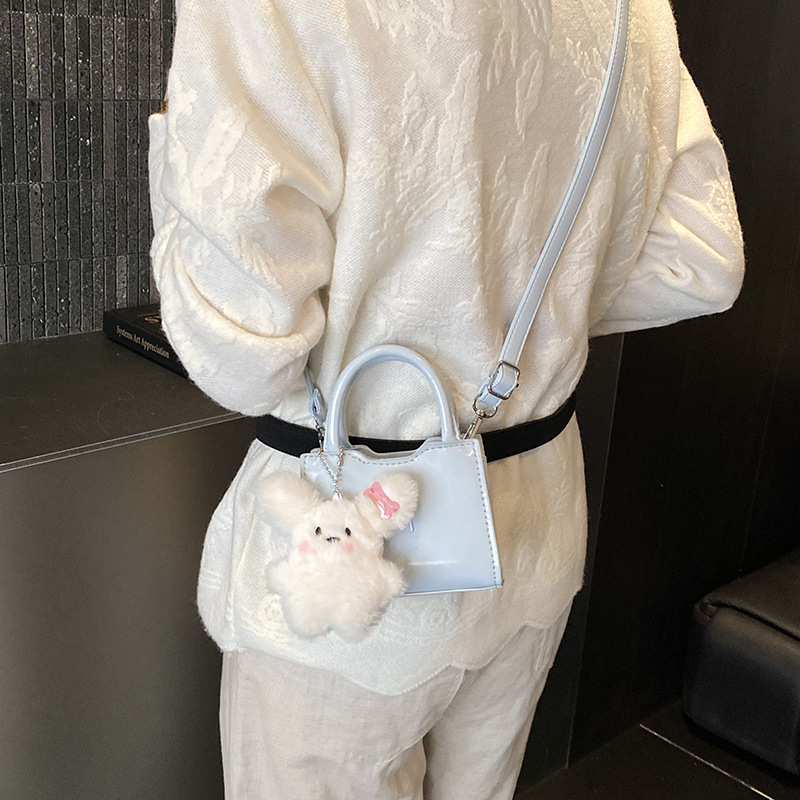 Bolsos coreanos para niños y niñas, lindos colgantes de peluche, bolsos de mano para bebés, bolsos mini para niños.