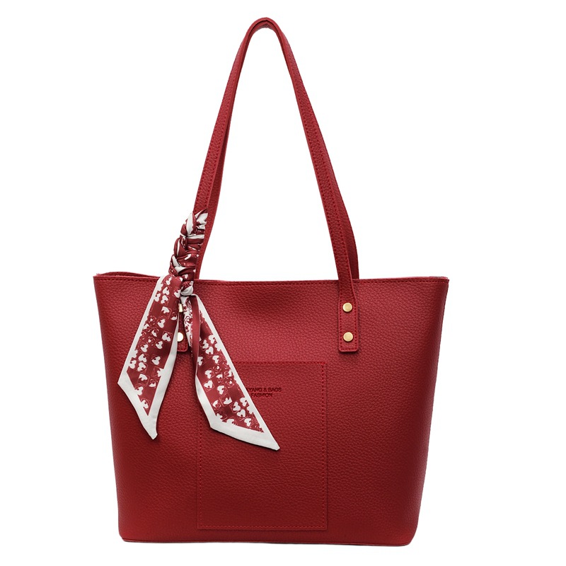 Bolso rojo de gran capacidad para mujeres versátil 2025 nuevo bolso de hombro casual simple para trabajar bolso de viaje