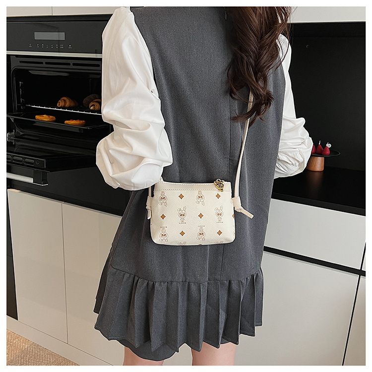 This is a niche design for women, featuring cartoon animal prints. It is a pink backpack with a high level of appearance and large capacity for travel undefined