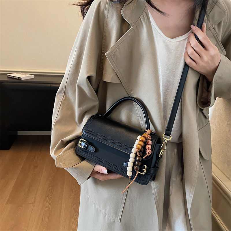 Bolso de mano popular de mujer de alto nivel de moda versátil bolso de hombro pequeño otoño y invierno 2025 nuevo tipo de mochila de viaje