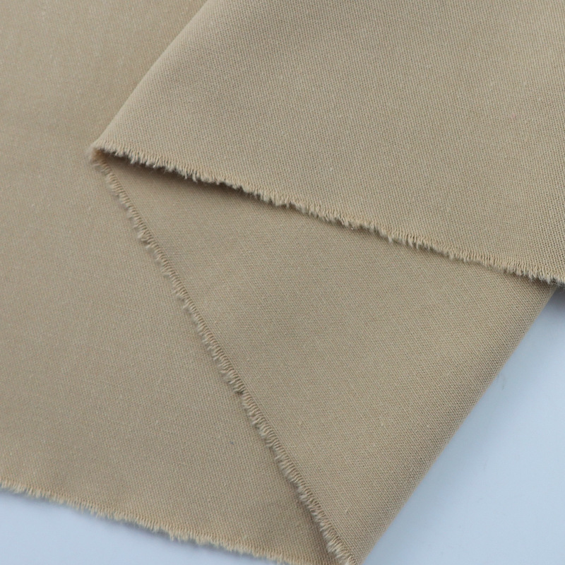 Algodón engrosado de alta densidad sarga lavada tela algodón fabricante en stock primavera y verano casual suspender pantalones overoles chaqueta tela